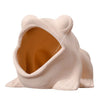 A light pink ceramic aquarium shrimp hideaway cave with an entrance visible.