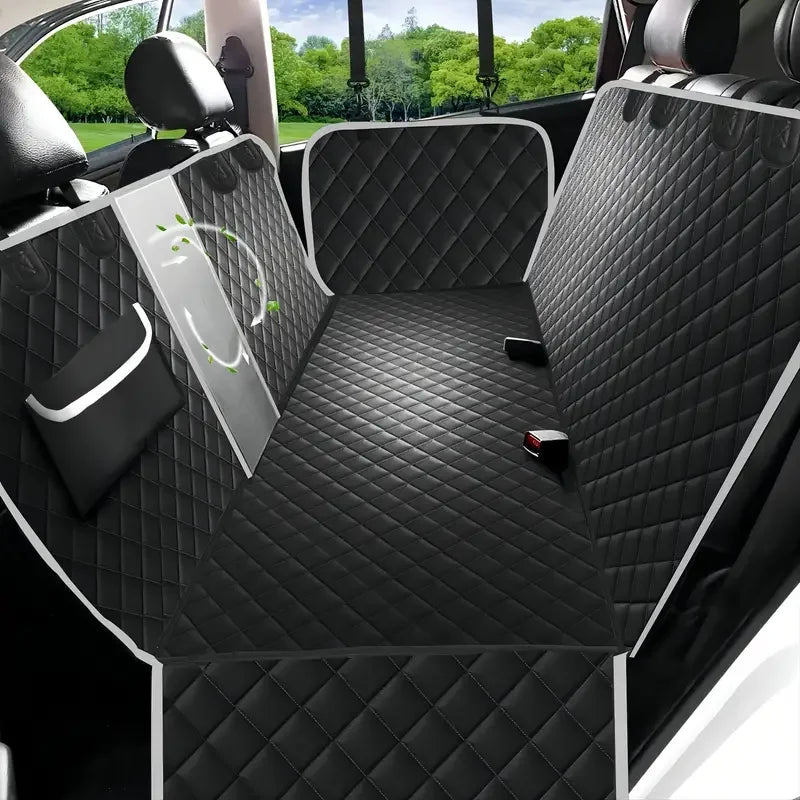 Black waterproof dog backseat cover with diamond stitching shown inside a car