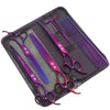 A black case holds a pair of purple professional stainless steel pet grooming scissors and a grooming comb.