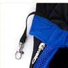 A close-up of a black and blue breathable mesh pet carrier backpack with a silver clip.