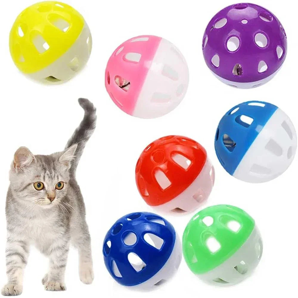 A multi-pack of colorful plastic cat toy balls in yellow, pink, purple, red, blue, and green.