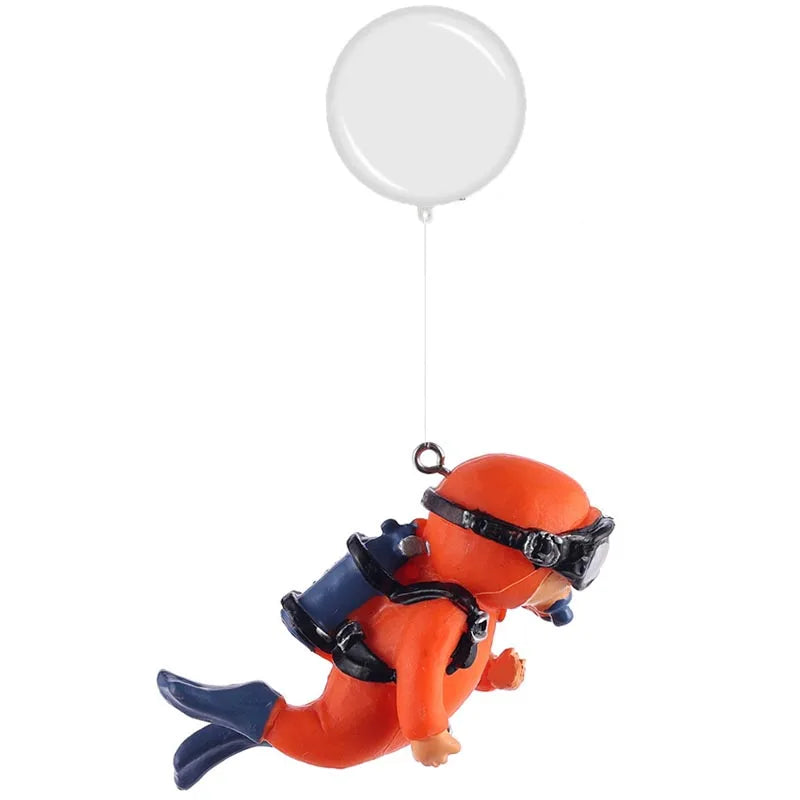 Orange resin mini diver aquarium ornament with black gear suspended by a white balloon