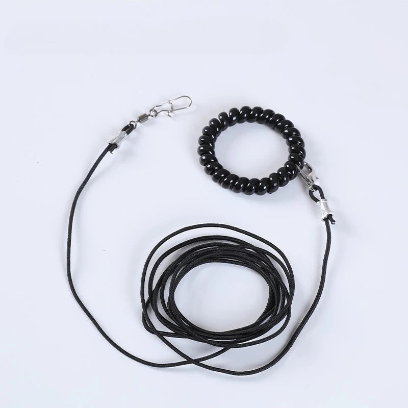 Black outdoor training harness for parrots with a beaded collar and leash
