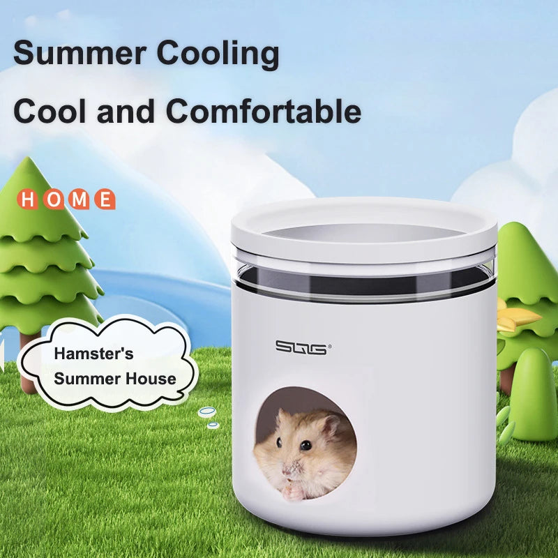 A white cooling hideout for hamsters is shown outdoors on green grass, with a small hamster peering out of the transparent li