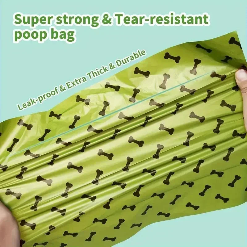 A roll of super strong and tear-resistant green poop bags being held up.