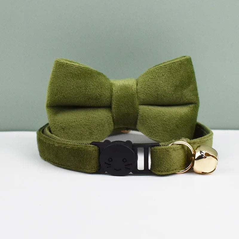 Olive green velvet cat collar with a bow knot and a gold safety buckle.