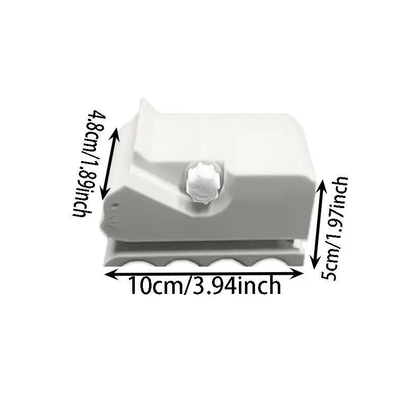 A white handheld cardboard strip cutter with a serrated edge, shown from above.
