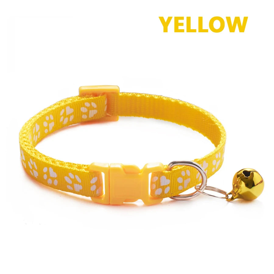 Yellow adjustable pet collar with a bell and a gold-colored charm