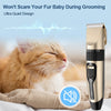A golden-colored cordless pet grooming clipper is shown next to a cat being groomed, emphasizing a quiet design.