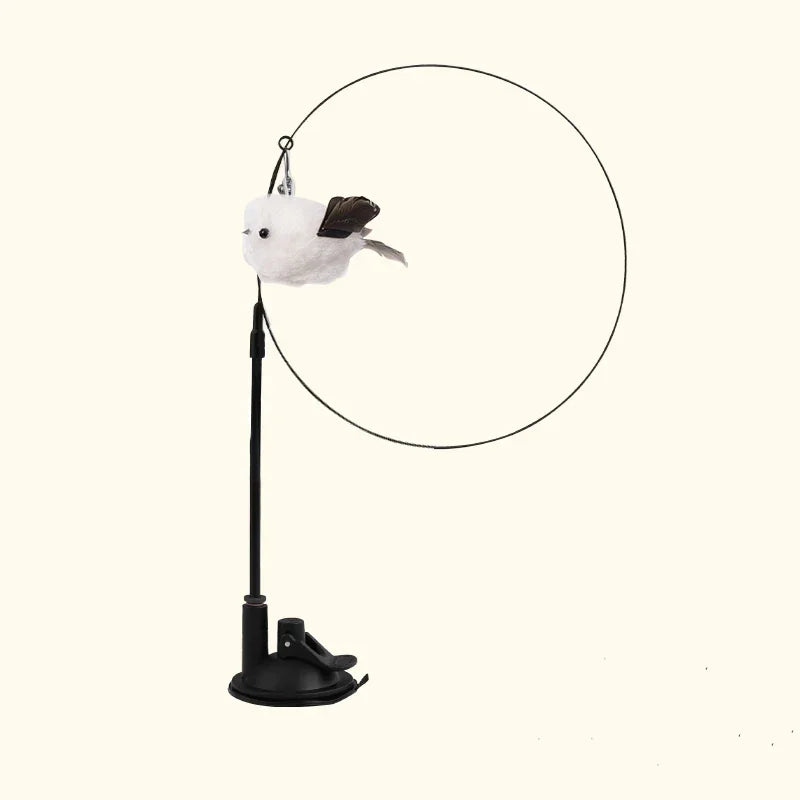 A white cat toy featuring a feather wand attached to a hanging mechanism.