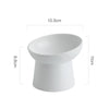 White elevated ceramic food bowl with a wide rim and a sturdy base.