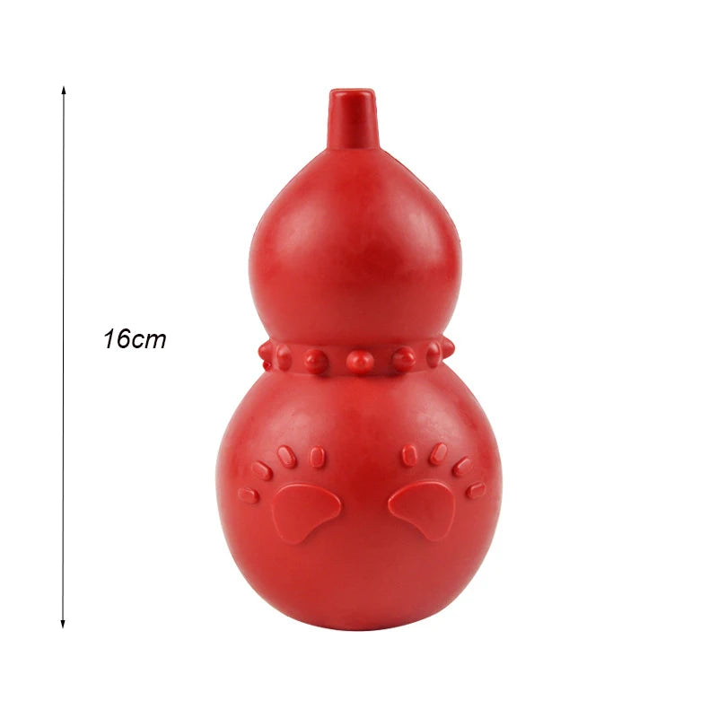A bright red, smooth, rounded dog chew toy with a small protrusion and decorative bumps.