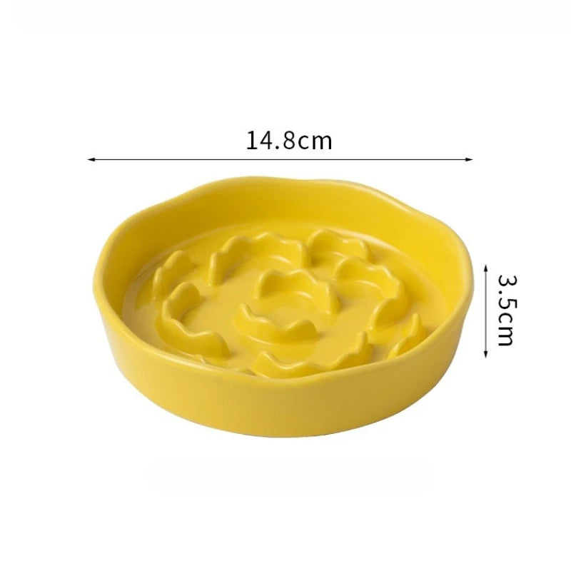 Yellow ceramic slow feeder pet bowl with a raised neck for safe feeding