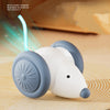 A white, rotating feather cat toy is shown with a blue light emanating from it on a woven surface.