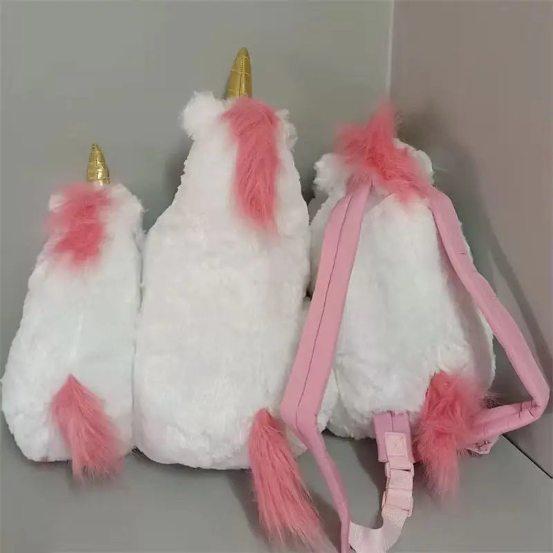 White unicorn plush doll with pink accents and a pink strap.
