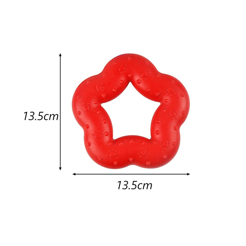 A bright red, flexible, donut-shaped dog chew toy for teeth cleaning and gum massage.