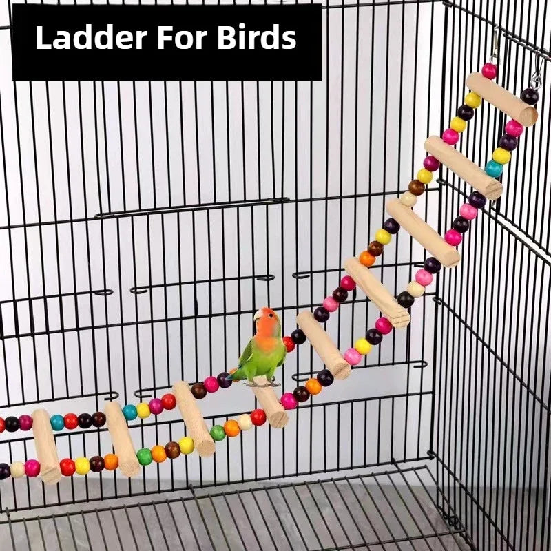 A natural wood parrot climbing ladder and swing toy with colorful balls inside a bird cage.