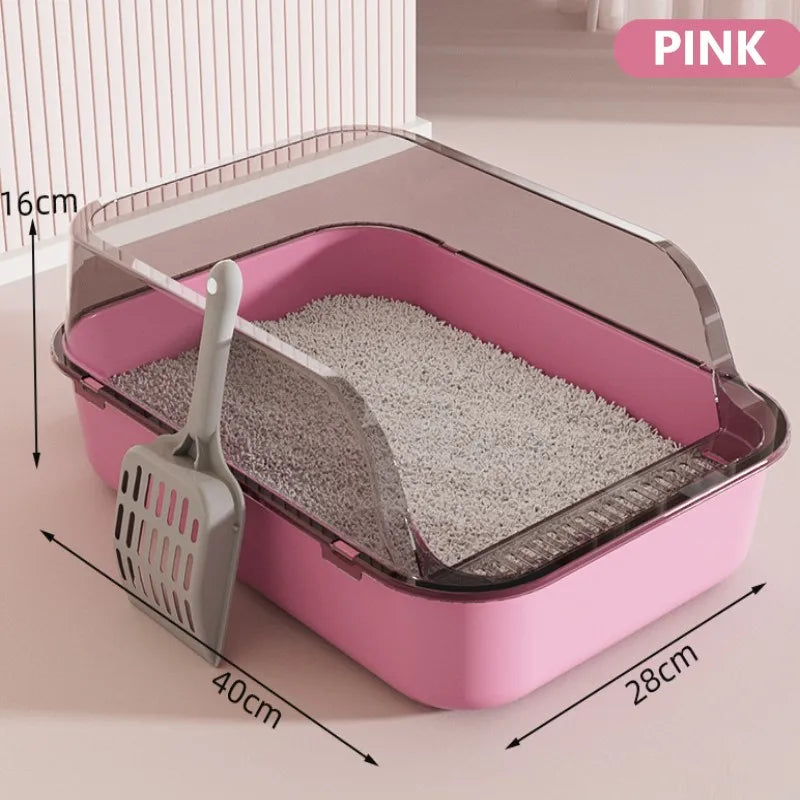 Pink semi-enclosed splashproof cat litter box with a scoop and litter inside