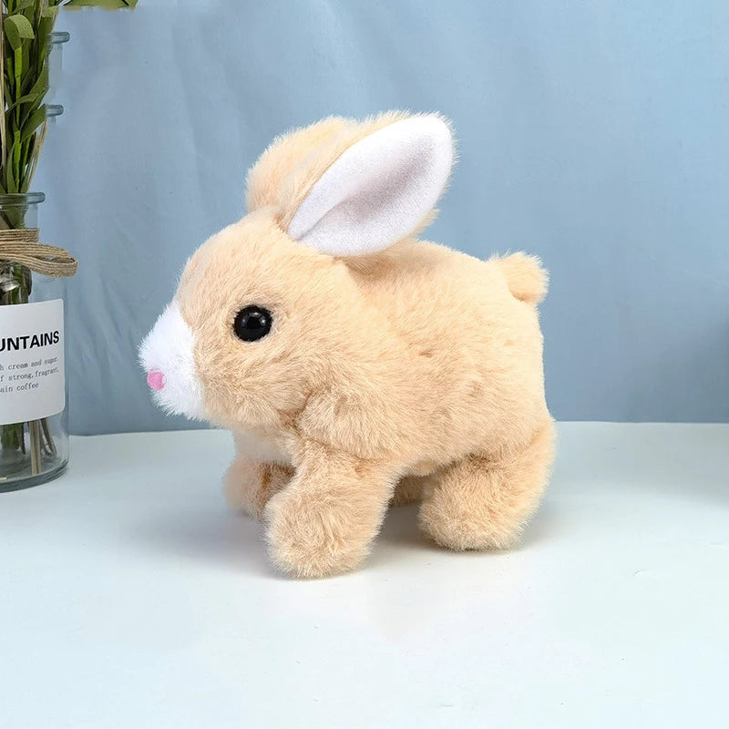 A fluffy, light tan plush bunny with white inner ears is shown against a light blue background.