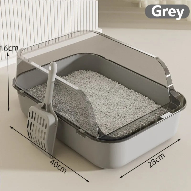 A grey semi-enclosed splashproof cat litter box with a scoop is shown on a light surface.