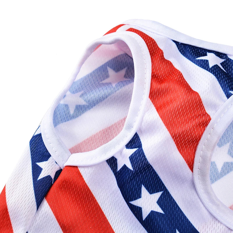 A close-up of a patriotic Independence Day dog t-shirt featuring red, white, and blue stripes and stars.