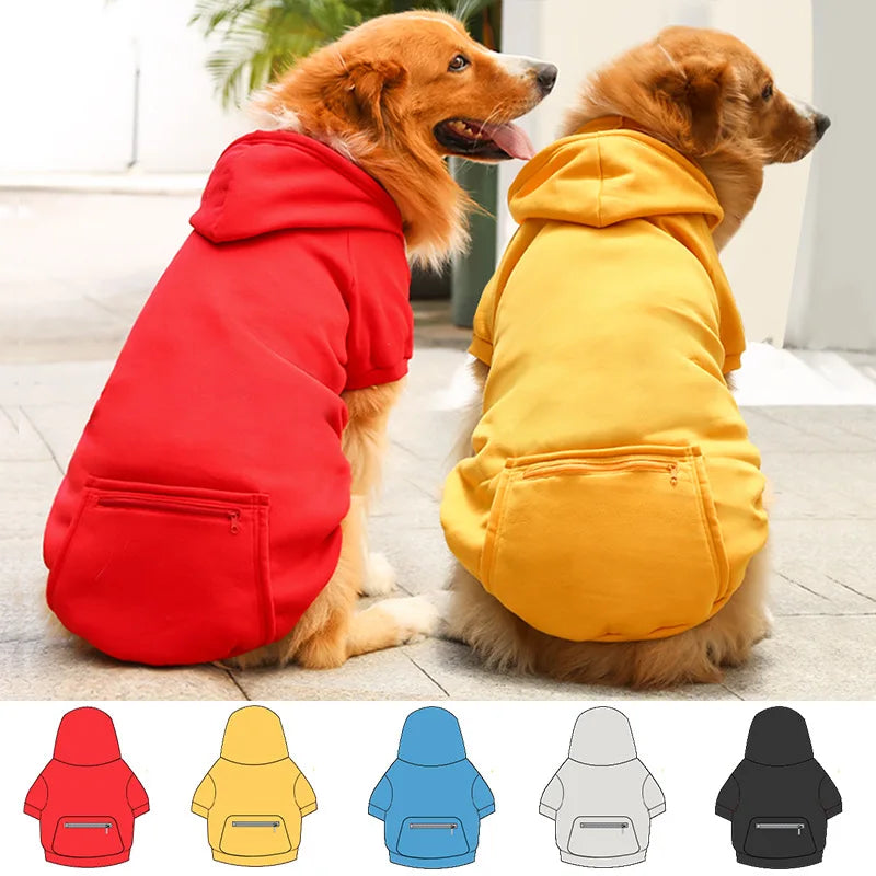 A collection of reversible dog jackets in red, yellow, blue, and gray fleece lining.