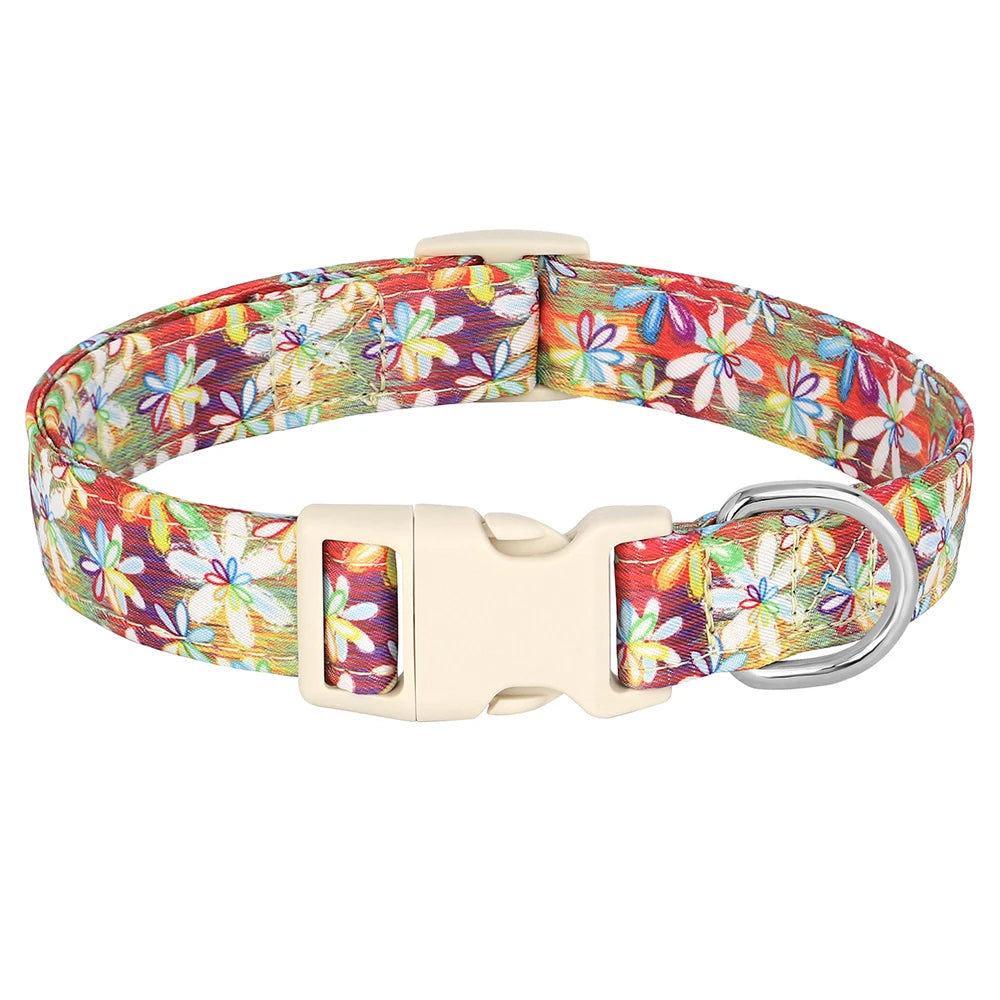 A beige nylon dog collar featuring a vibrant print of bees and flowers.