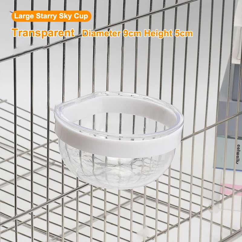 A clear glass bowl with a white rim is shown hanging in a metal wire grid.