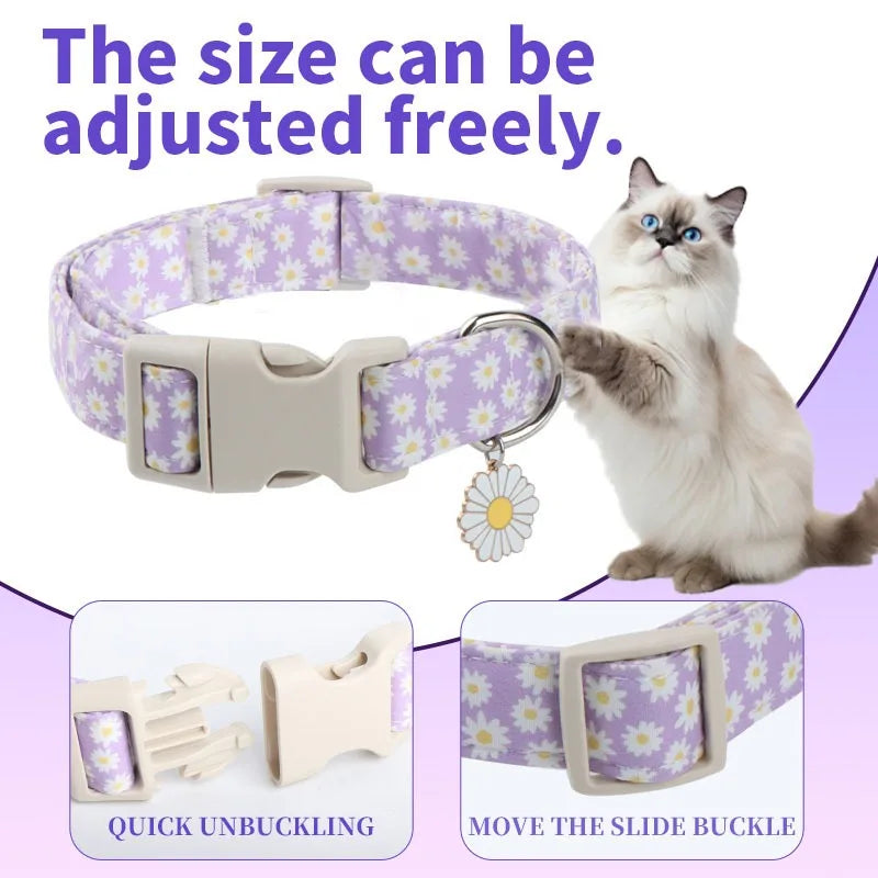 A white cat wearing a purple and white adjustable dog collar with a flower decoration, showing quick unbuckling and slide buc