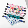 A set of printed pet collars with matching fabric bandanas for small dogs and cats in various patterns.