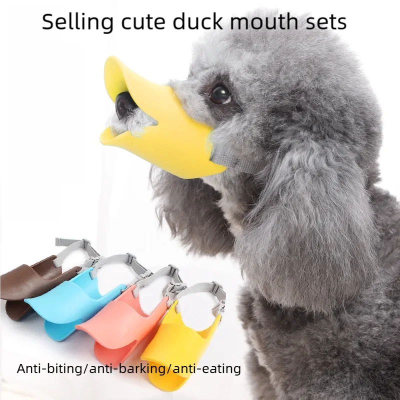 A gray, fluffy dog is shown with a yellow silicone duck mouth set attached to its snout.