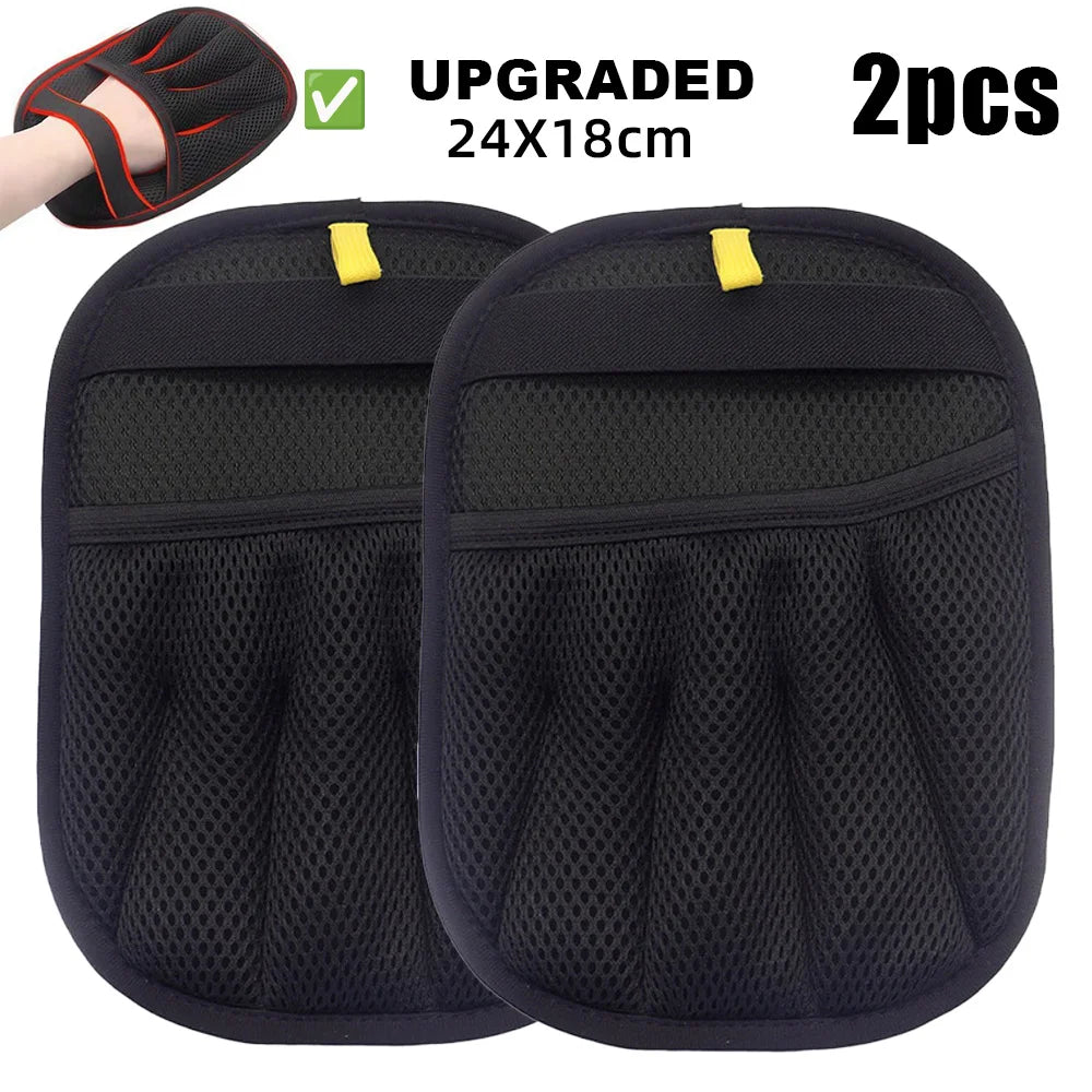 Two black reusable pet grooming gloves with a mesh design and yellow tabs are shown.