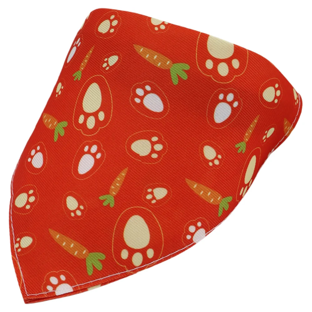 Orange fabric bandana with a repeating pattern of cat paw prints and carrots for dogs and cats