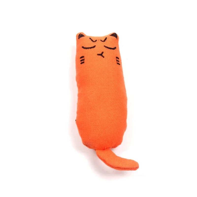An orange plush cat toy shaped like a face with soft thumb pillow design.