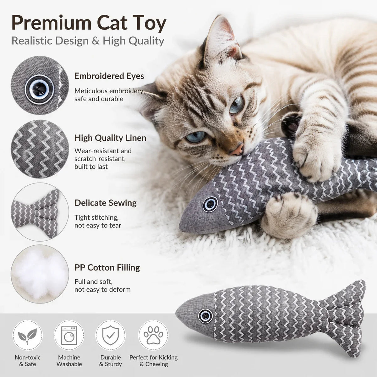A tabby cat is playing with a gray, textured fish plush toy designed for indoor cats.