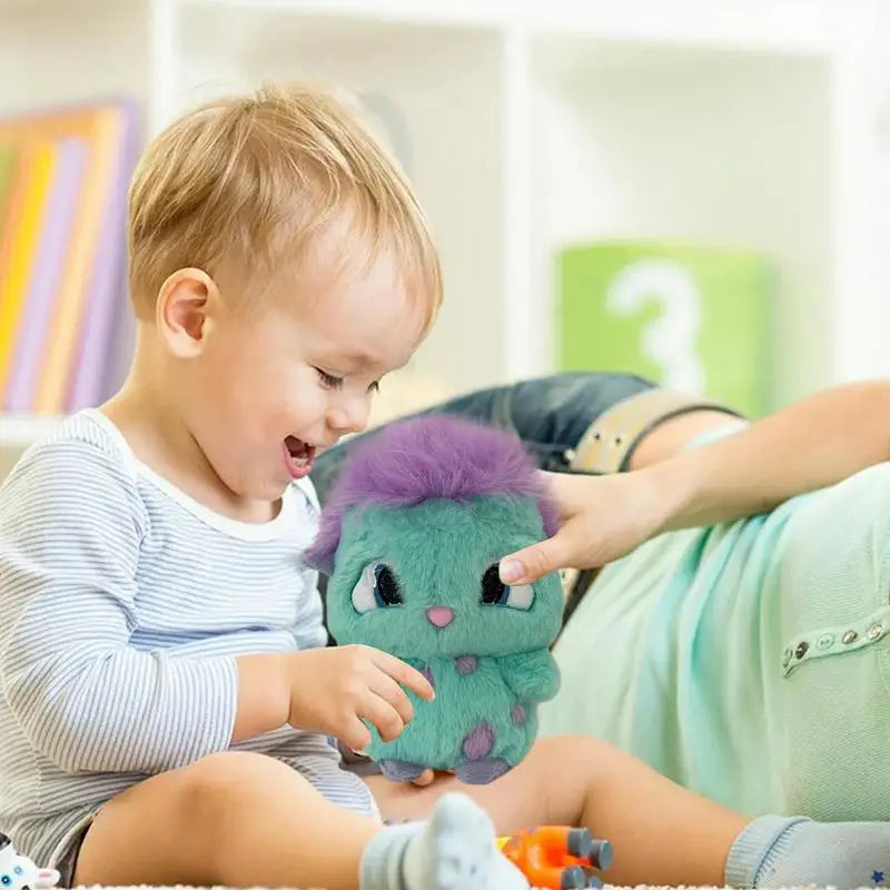 A toddler is interacting with a purple and green Bibble plush toy in a bright indoor setting.
