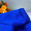 A close-up of a royal blue cotton dog hoodie sweatshirt fabric.