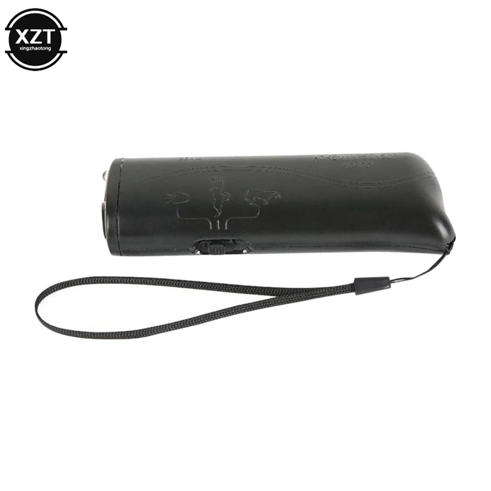 Black 3-in-1 ultrasonic dog training device with an LED light and a flexible cord.