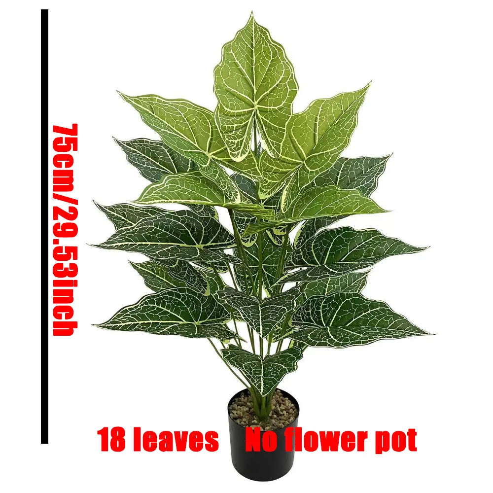 A bouquet of 18 artificial monstera leaves in various shades of green displayed in a black pot.