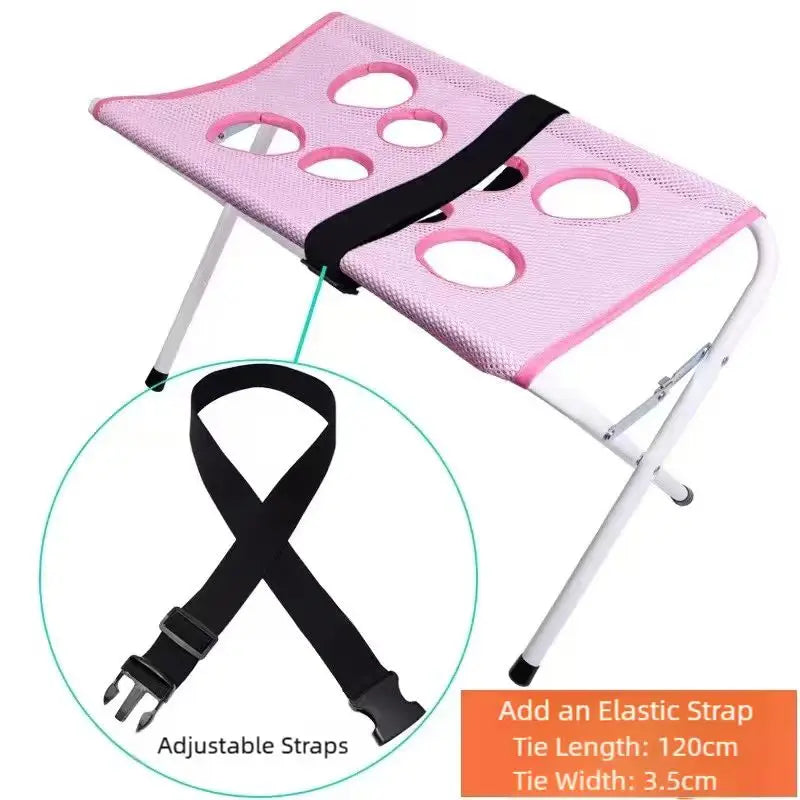 Pink foldable pet grooming hammock with adjustable straps for bathing and nail trimming