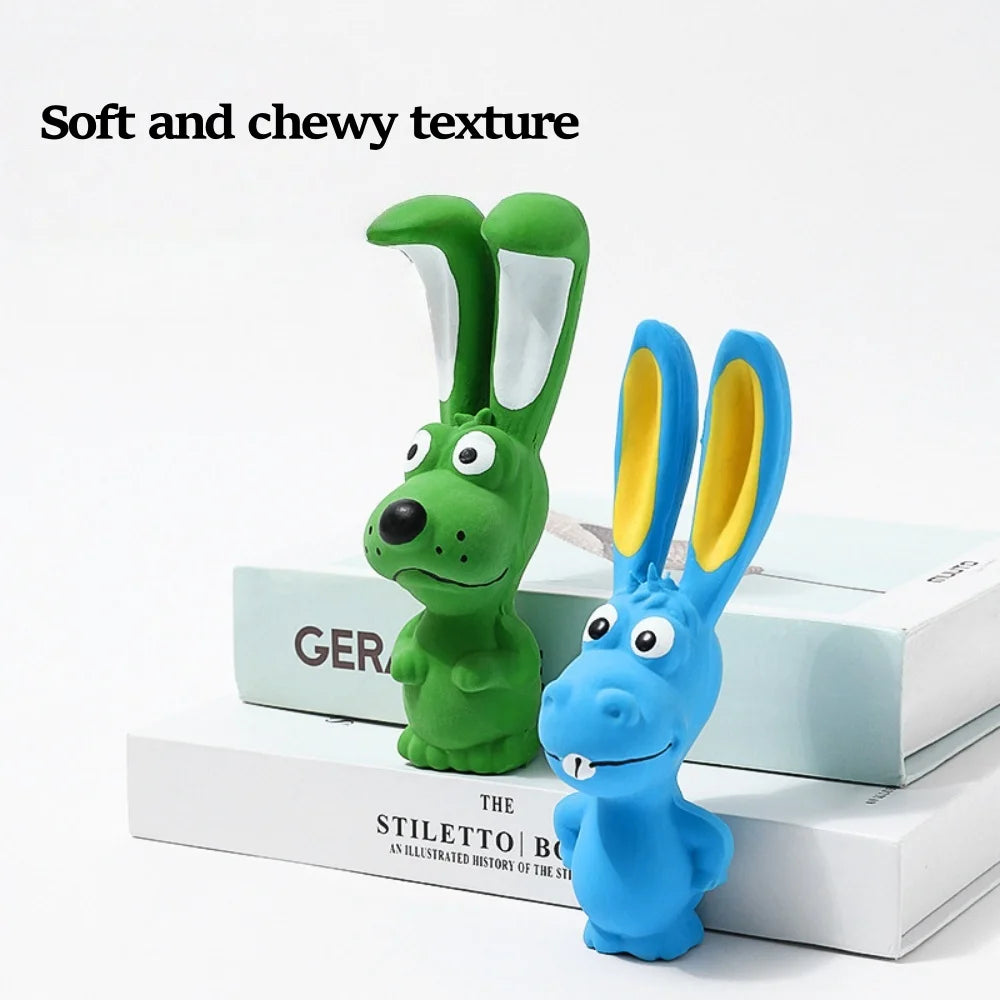 A blue squeaky rabbit chew toy for dogs with soft and chewy texture resting on a white box.