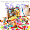 A pile of assorted colorful yarn and fabric toys for cats, including pom-poms, ribbons, and string toys.