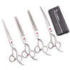 A set of professional stainless steel pet grooming scissors and combs on a black case.