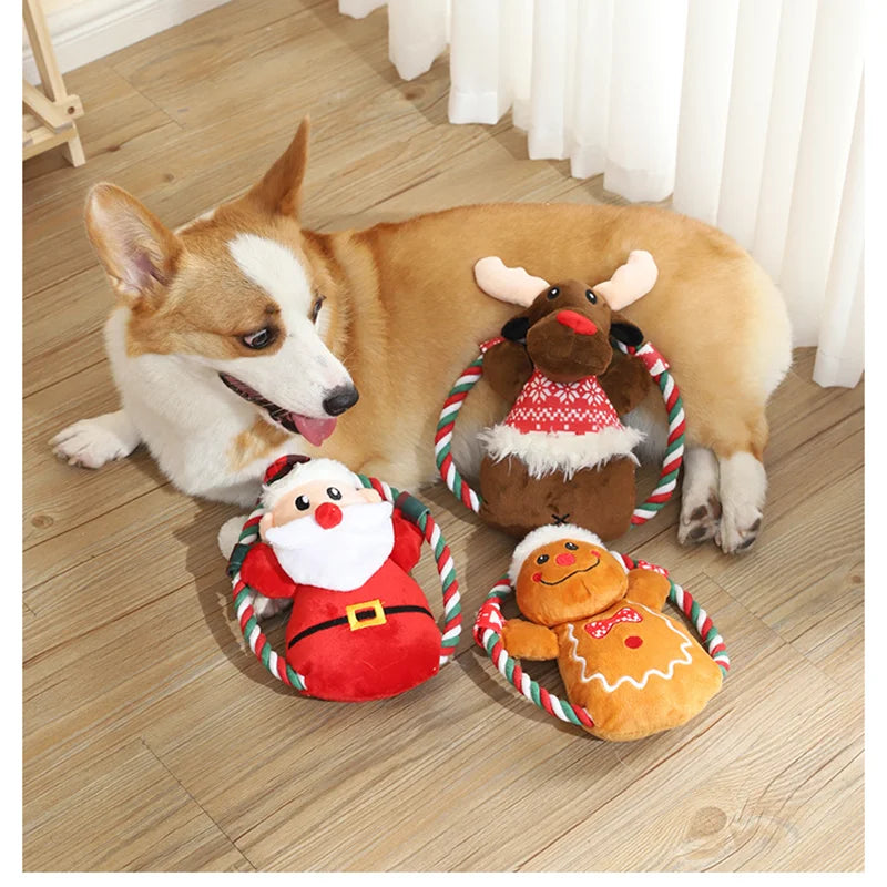 A collection of holiday plush squeak toys for dogs, including Santa, elk, gingerbread man, and donut designs.