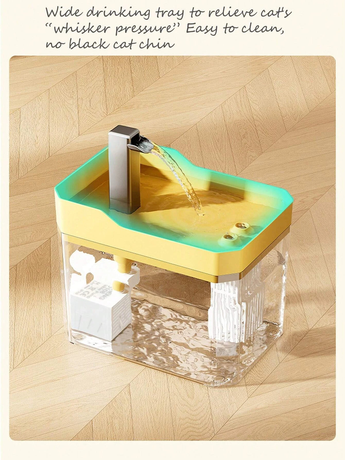 A wide drinking tray for a cat water fountain with a yellow and green design, showing water flowing.