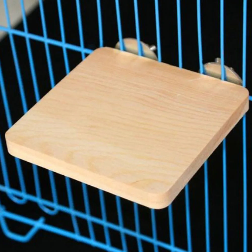 A natural wood platform stand for birds or small pets is visible inside a blue wire cage.