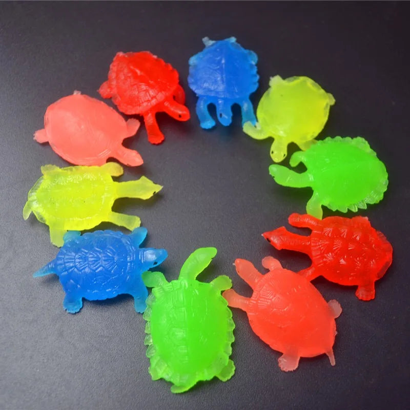 A set of ten colorful soft rubber goldfish bath toys arranged in a circle.