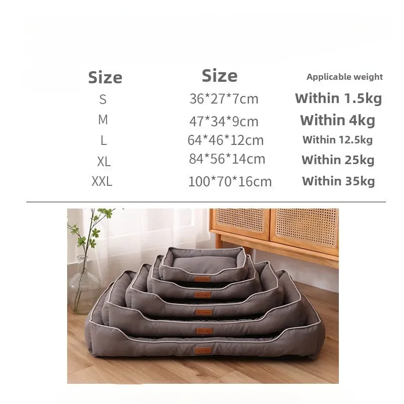 A stack of gray faux fleece pet sofa beds or dog beds shown on a wooden floor.