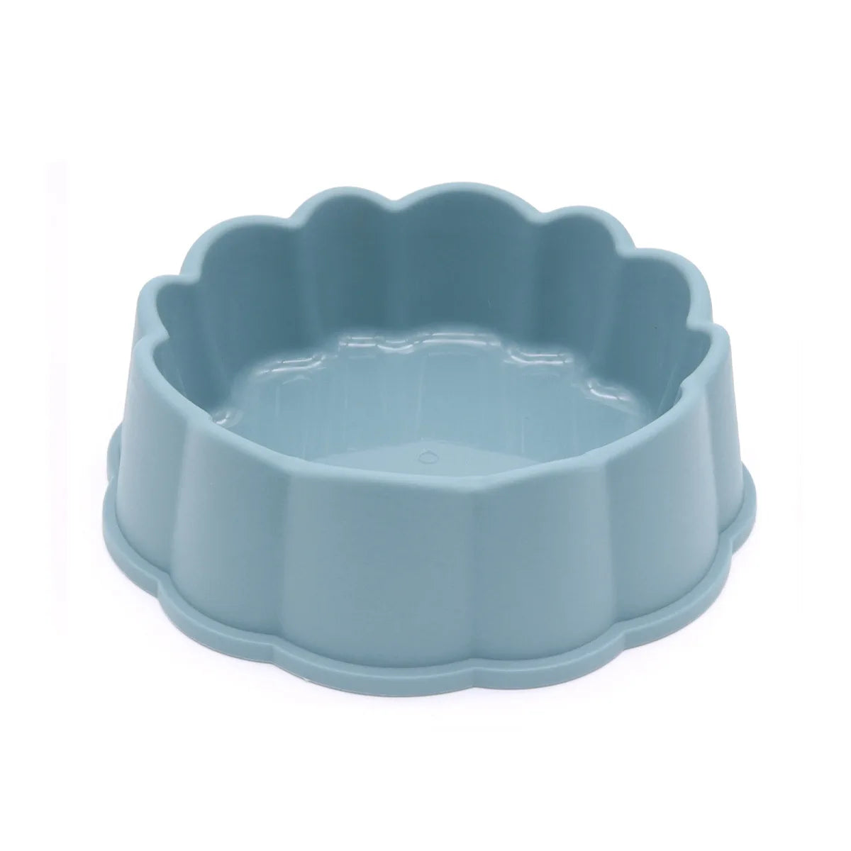 A light blue non-slip pet feeding bowl with a scalloped edge.