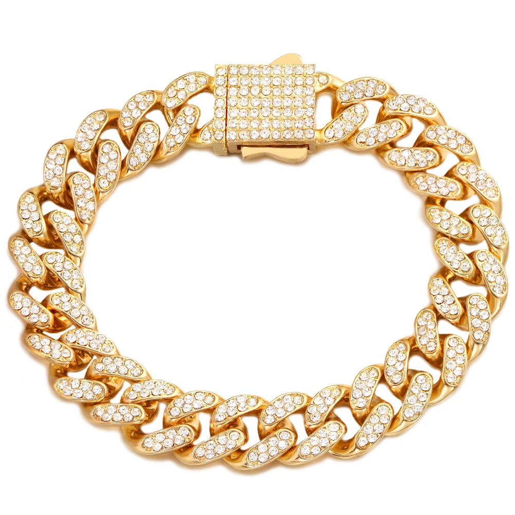 A gold iced out Cuban link bracelet with rhinestone accents shown against a white background.